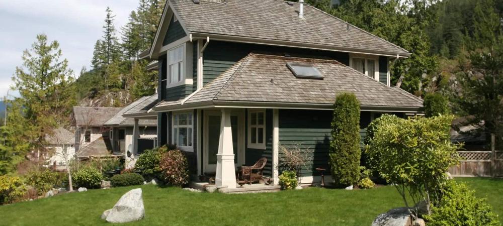 mountain house with green yard